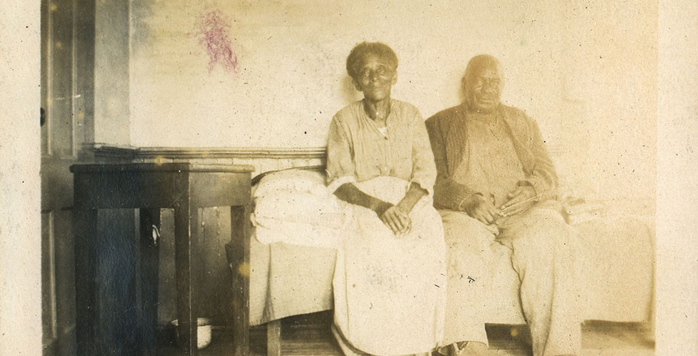 Sally and Alec in the kitchen, c. 1920